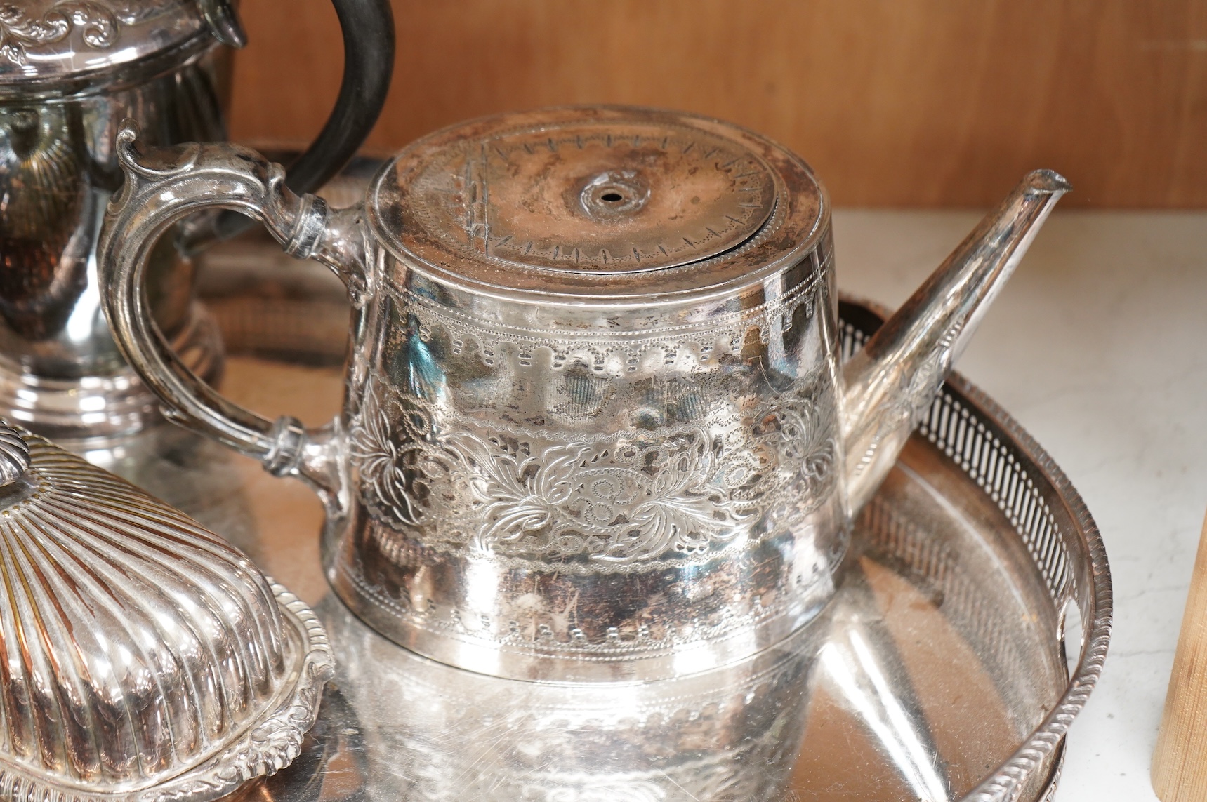 A quantity of plated wares to include a galleried tray, teapot, jug and bon bon dish with glass liner, largest 45cm wide